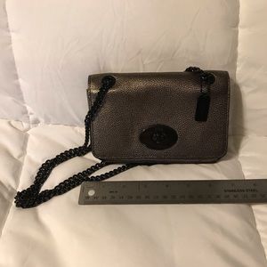 Metallic gold Coach crossbody bag